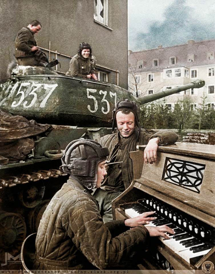 #91 Crew members of Nº537 Soviet IS-2 tank of the 87th Guards Heavy Tank Regiment take a break in Breslau (now Wrocław in Poland) 27th April 1945