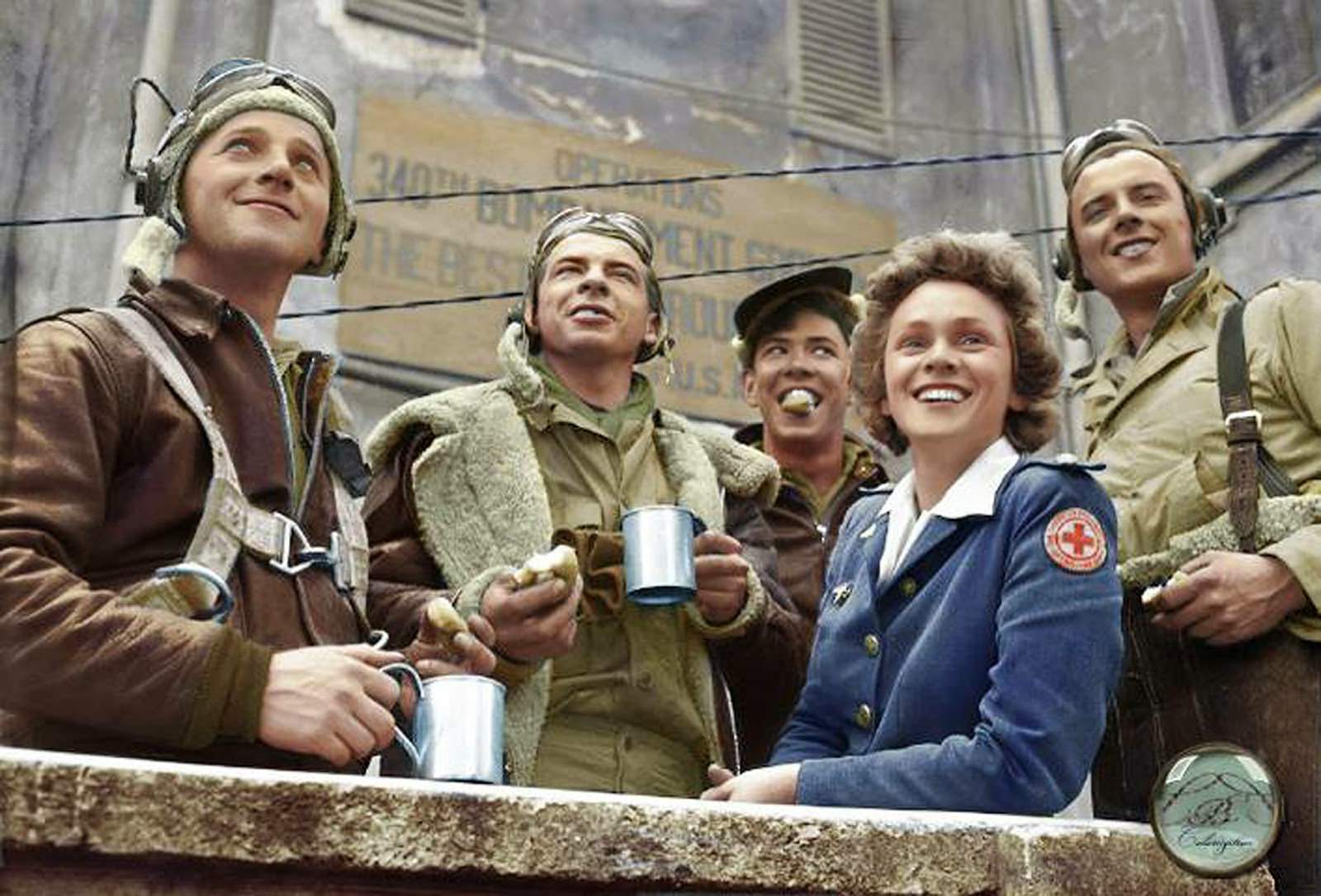 #100 From Left to Right, B-25 crew members: Sgt. John C. Bellendir (Gnr.), Chicago; Sgt. Raymond J. Swingholm (Eng/Gnr.), Lebanon, PA; Sgt. Harris B. Pate (Rd/Gnr.), Hamlet, NC; Red Cross Clubmobile Worker, Peggy Steers from White Plains, NY. and T/Sgt. Aubrey Chatters (Rd/Gnr.), Milington MI. All from t