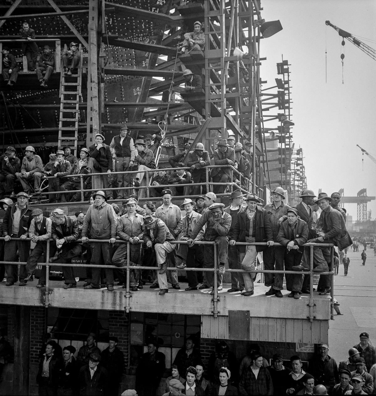 #4 Workers gather to watch a launching ceremony