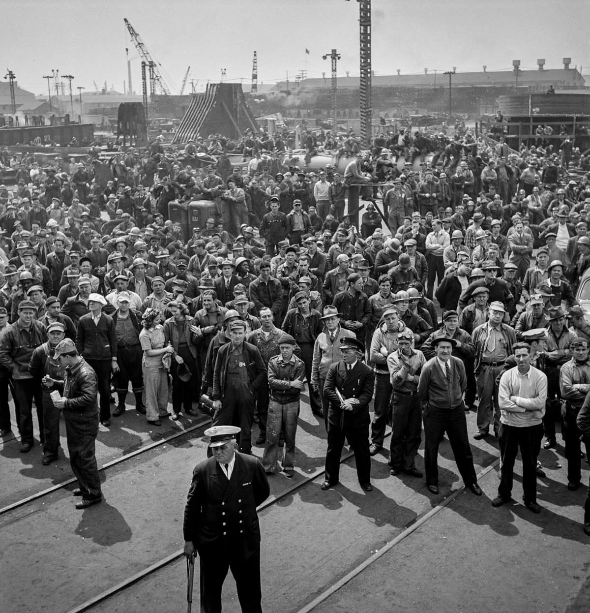 #35 Workers gather for a ship launching ceremony