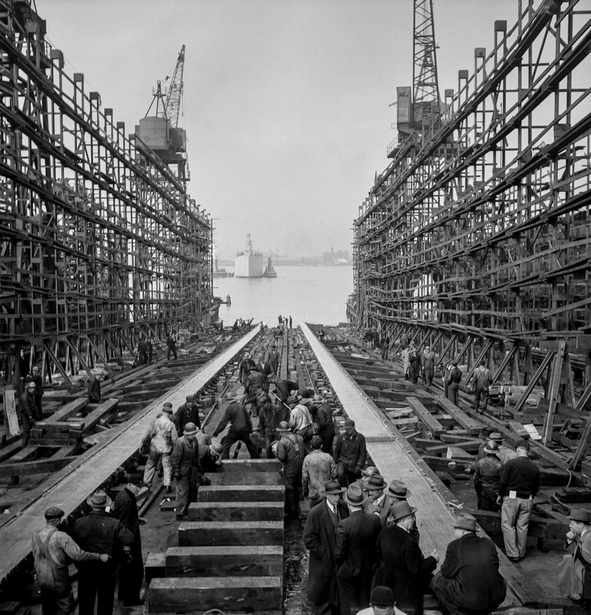 #40 After a launch, workers fill the way and prepare to build another ship