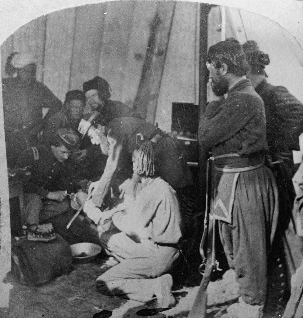 #12 Army doctors performing an amputation in a make-shift hospital during the U.S. Civil War (1861-65), 1863.