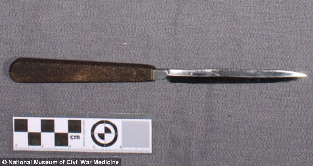 #38 This large single-edged amputation knife was used to cut through skin and muscle in circular amputations