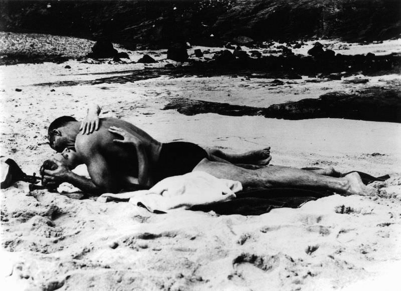 Burt Lancaster and Deborah Kerr kiss on the beach in a scene from the film ‘From Here to Eternity’, 1953.