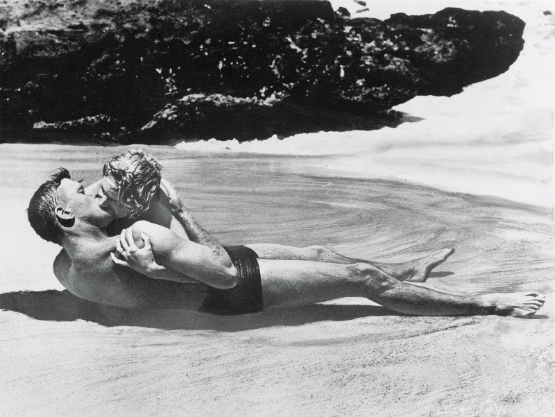 Burt Lancaster and Deborah Kerr passionately kissing in a scene from ‘From Here to Eternity,’ Halona Cove, Oahu, Hawaii, 1953.