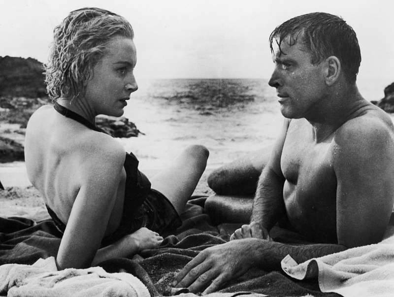 Deborah Kerr and Burt Lancaster lay on the beach in a still from the film ‘From Here to Eternity,’ 1953.
