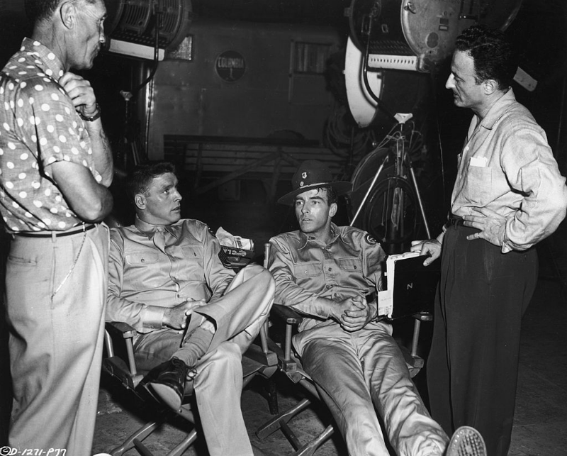 Technical advisor Mushy Callahan, Burt Lancaster, Montgomery Clift and director Fred Zinnemann speak between scenes on the set of ‘From Here To Eternity,’ 1953.