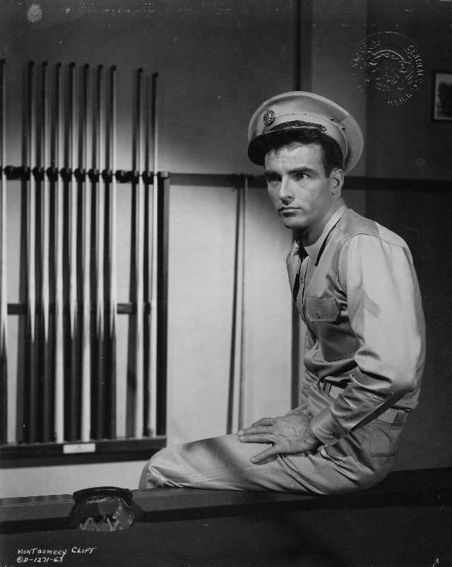 Montgomery Clift sits on a pool table in a scene from the film ‘From Here to Eternity,’ 1953.