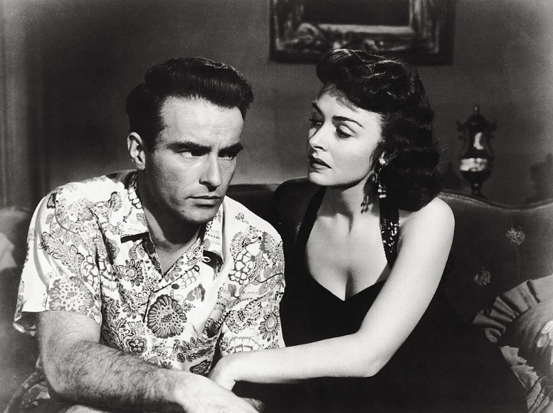 Montgomery Clift and Donna Reed dicussing, sitting down on a sofa, in ‘From Here to Eternity,’ 1953.