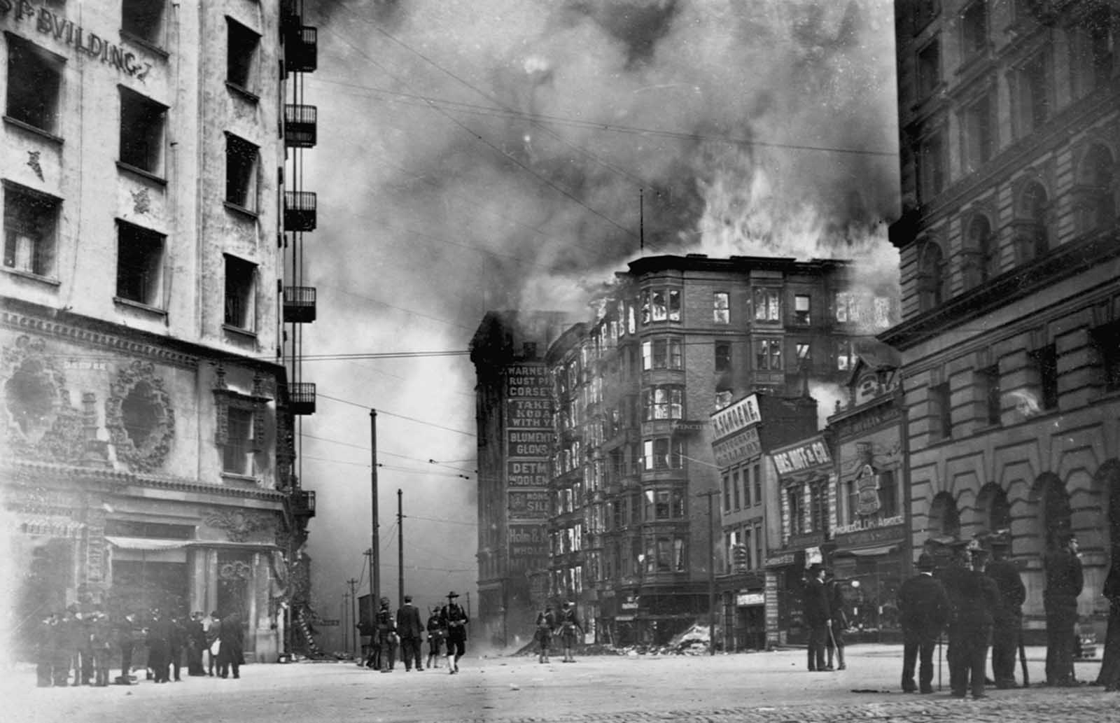 #4 People watch as the Winchester Hotel burns in the aftermath of the 1906 San Francisco earthquake.