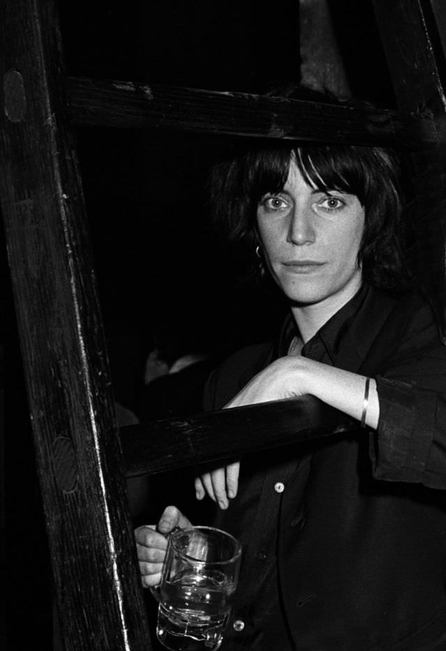 Patti Smith posed backstage before performing with the Patti Smith Group at CBGB’s club in New York City on April 4, 1975