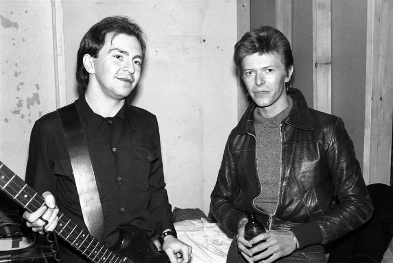 David Bowie and Gerald Casale of Devo pose backstage on November 14, 1977 at Max’s in Kansas City