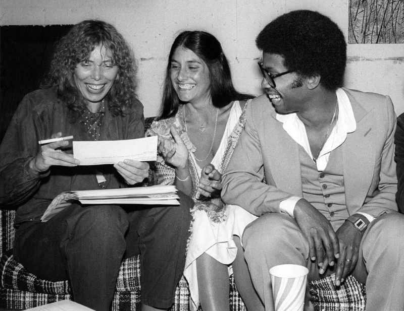 Joni Mitchell, Mimi Farina, and Herbie Hancock enjoy a moment backstage at the Berkeley Jazz Festival, which was held at the Greek Theatre in May 1979 in Berkeley, California
