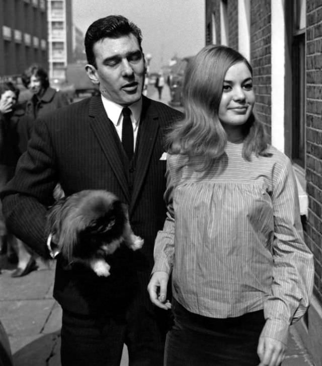 #28 Reggie Kray and Frances Shea outside the Kray home in Valance Road after he and Ronnie are acquitted of all charges of demanding money with menaces, 5th April 1965