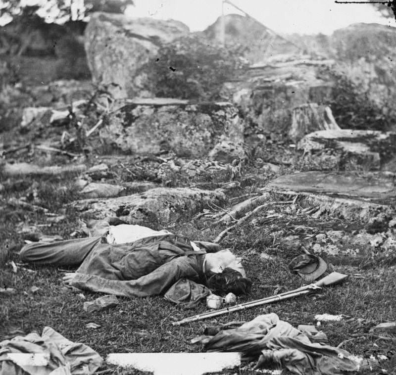 Confederate bodies lie dead in the area known as the “devil’s den.”