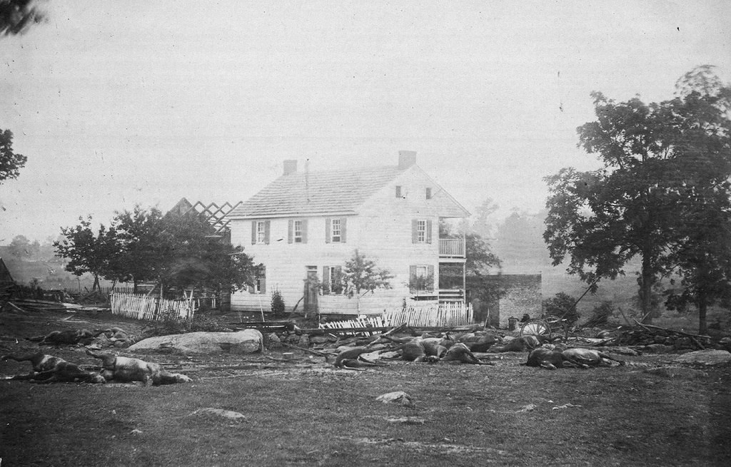 #10 Dead horses surround the Trostle House, which Union Major General Daniel Sickles used as his headquarters, and which was the scene of fierce fighting during the Battle of Gettysburg, in early July, 1863