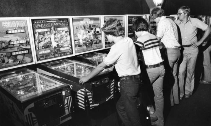 #19 Arcade goers playing on pinball machines at Cumberland Mall in Atlanta, Georgia, 1978
