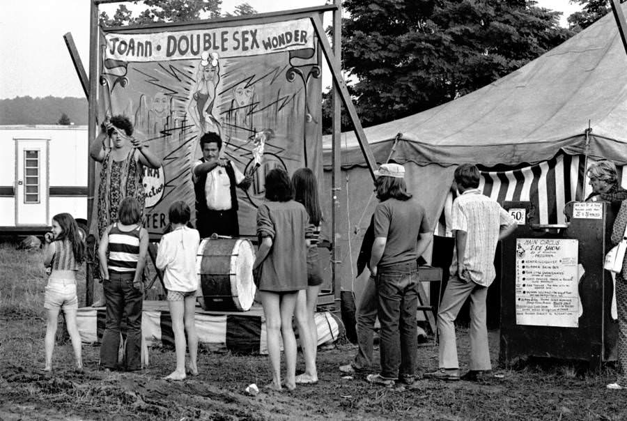A traveling circus sideshow attracts customers to see “JoAnn the Doublesex Wonder” during a stop in the small town of Abingdon, Virginia, 1967