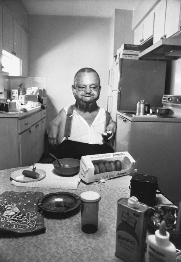 “Sealo the Sealman,” a retired sideshow performer, enjoying a donut for breakfast, 1960
