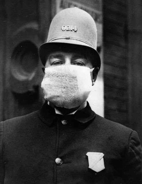 An American policeman wears a ‘flu mask’ to protect himself from the Spanish flu outbreak that followed World War I, 1918