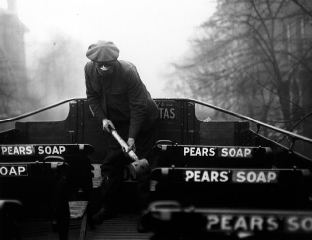A man prepares ‘anti-flu’ spray for buses of the London General Omnibus Co. London, March 2, 1920.