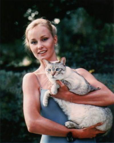 #14 A young Jessica Lange holding a fat cat, 1970s
