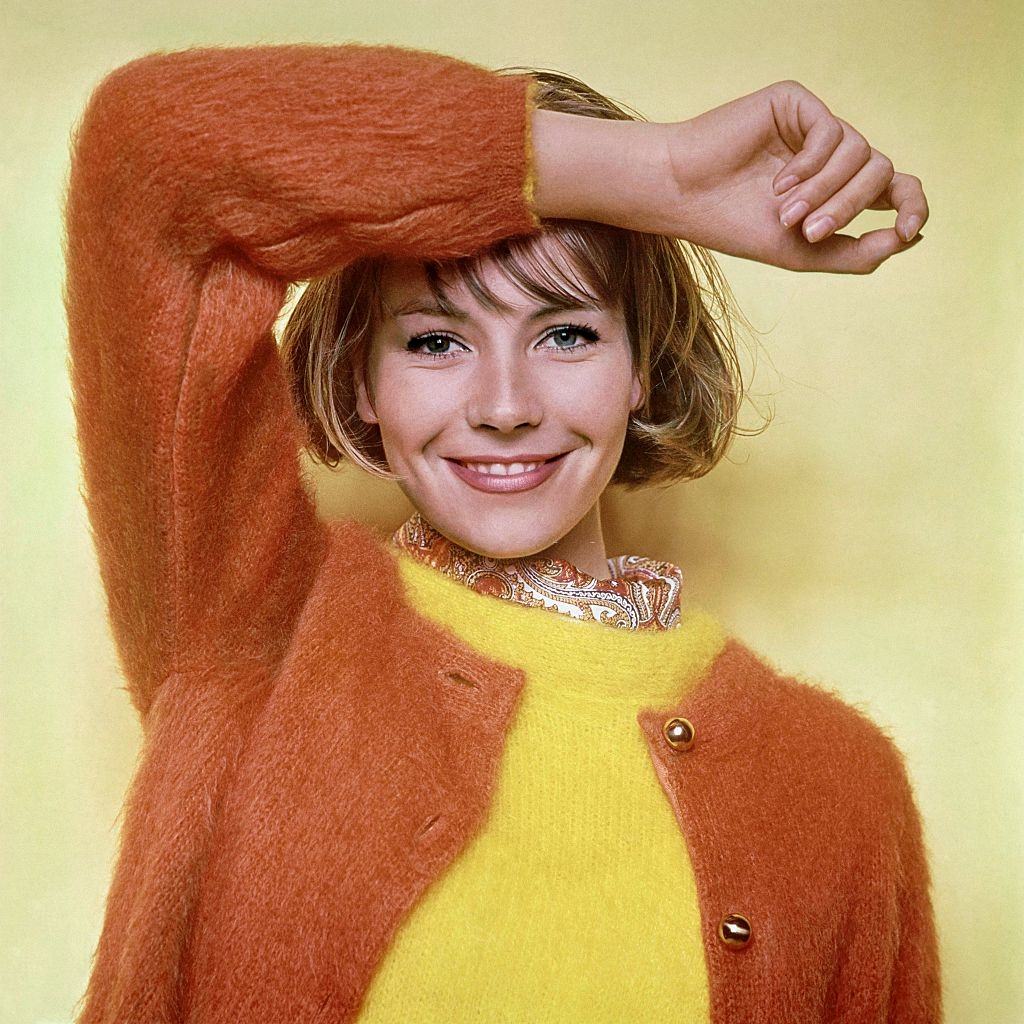 #11 Model Kyra wearing mohair sweaters, slipover and cardigan, Glamour 1961