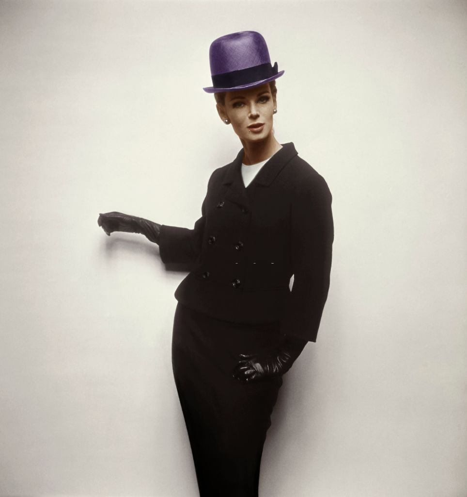 #23 Model wearing black tweed double breasted skirt suit, Vogue 1963