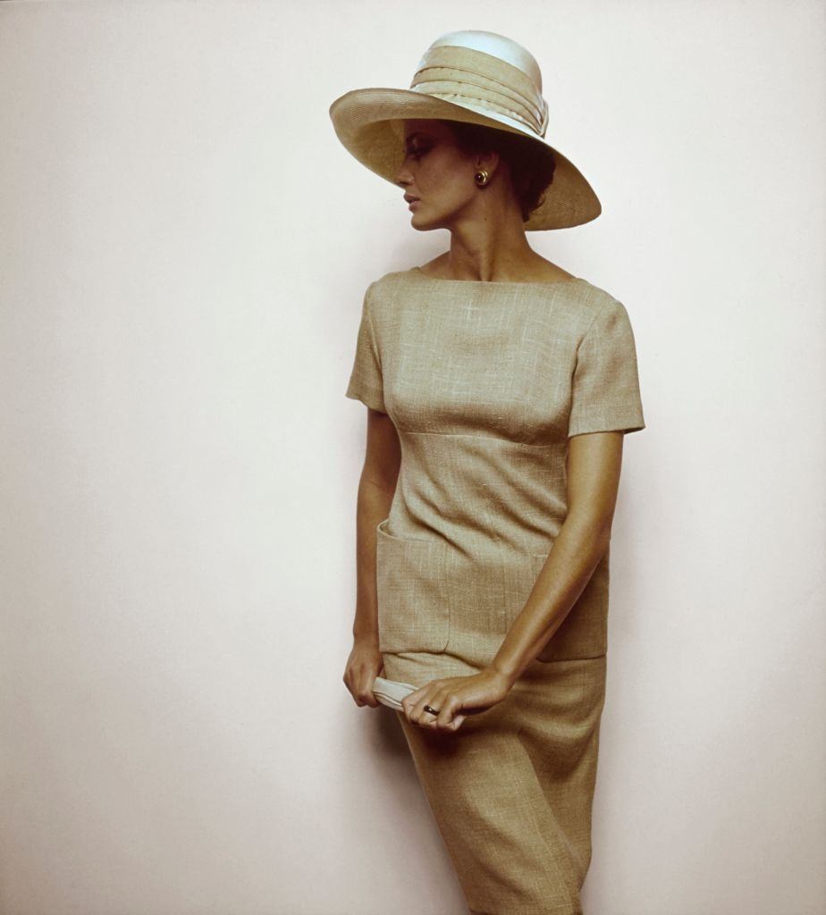 #26 Model wearing tawny linen, short sleeve dress, Vogue 1963