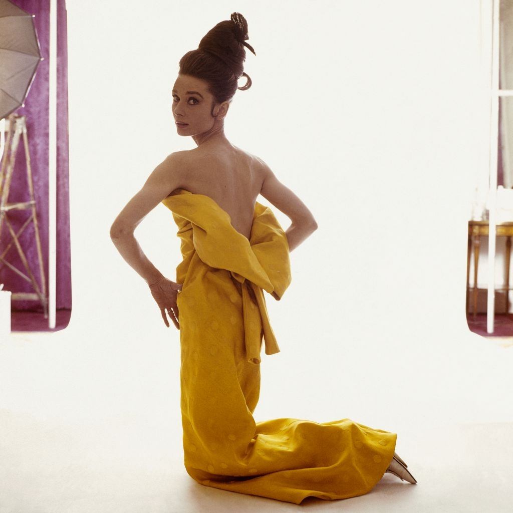 #30 Audrey Hepburn wearing a strapless yellow silk evening dress, Vogue 1963