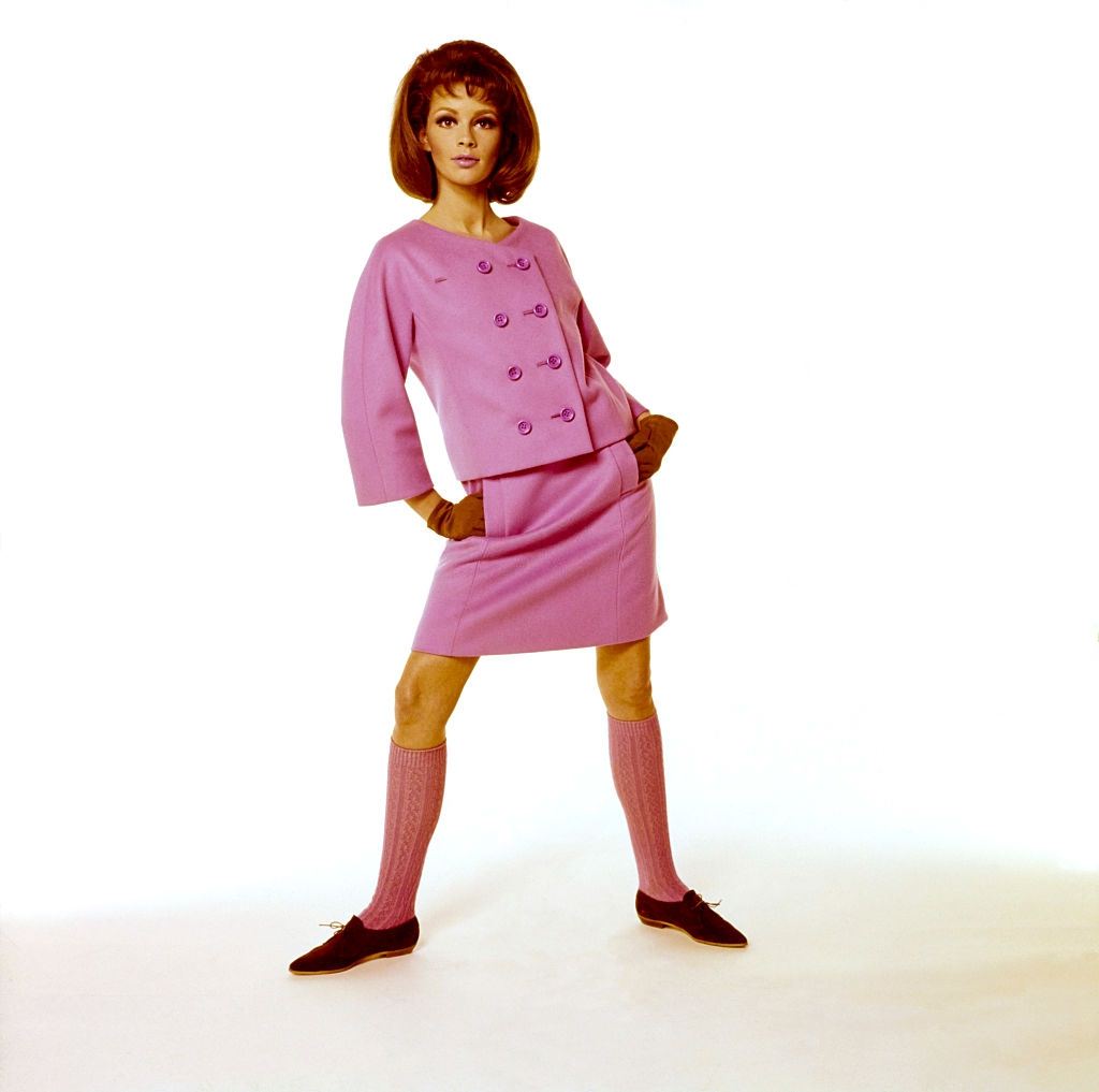 #35 Model wearing pink skirt suit with double breasted jacket, Vogue 1964