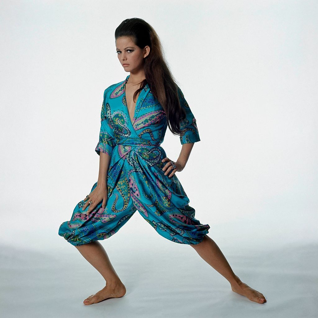 #51 Actress Claudia Cardinale wearing a Paisley-print pajama set, Vogue 1965