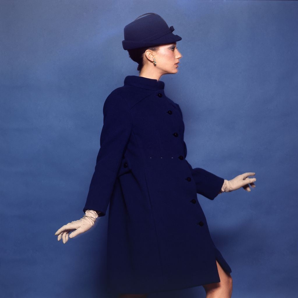 #56 Model and actress Marisa Berenson in a Jacques Tiffeau for Tiffeau & Busch wool smock coat, Vogue 1965