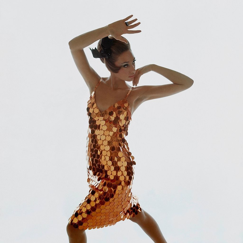 #61 Model Marisa Berenson wearing copper-colored sequin dress, Vogue 1966