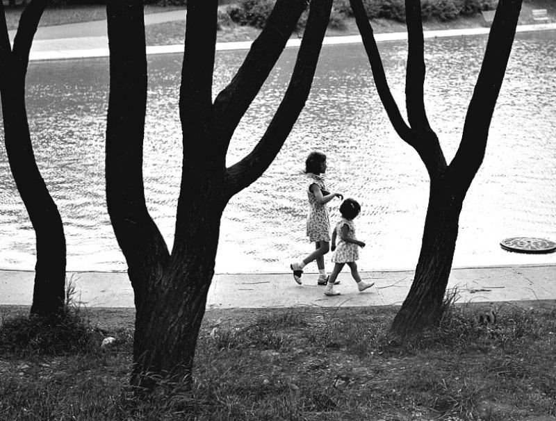 #33 Two children walk around the reflecting pool in Eden Park, June 10th, 1939