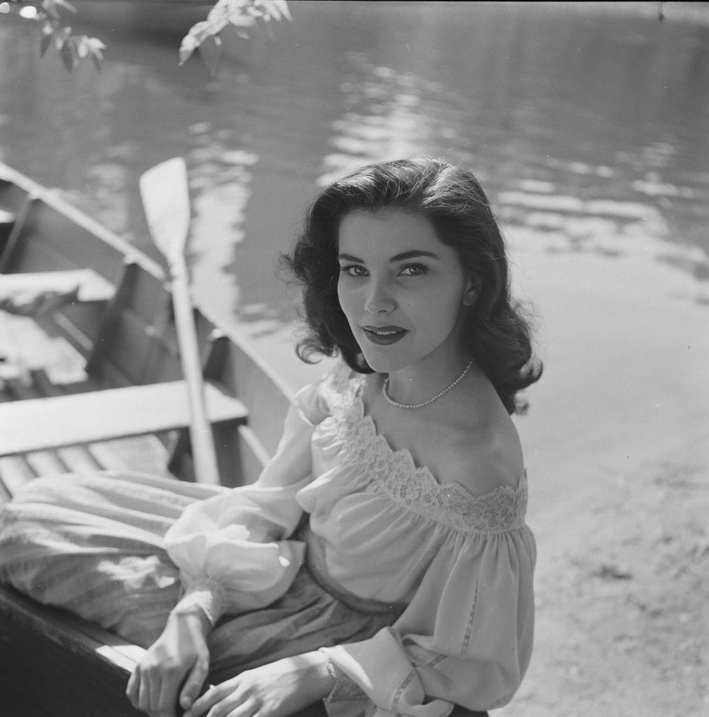 #41 Debra Paget, sitting on a boat in the United States, 1950