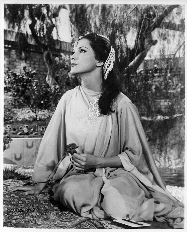 #27 Debra Paget looking up at the sky in a scene from the film ‘Omar Khayyam’, 1957