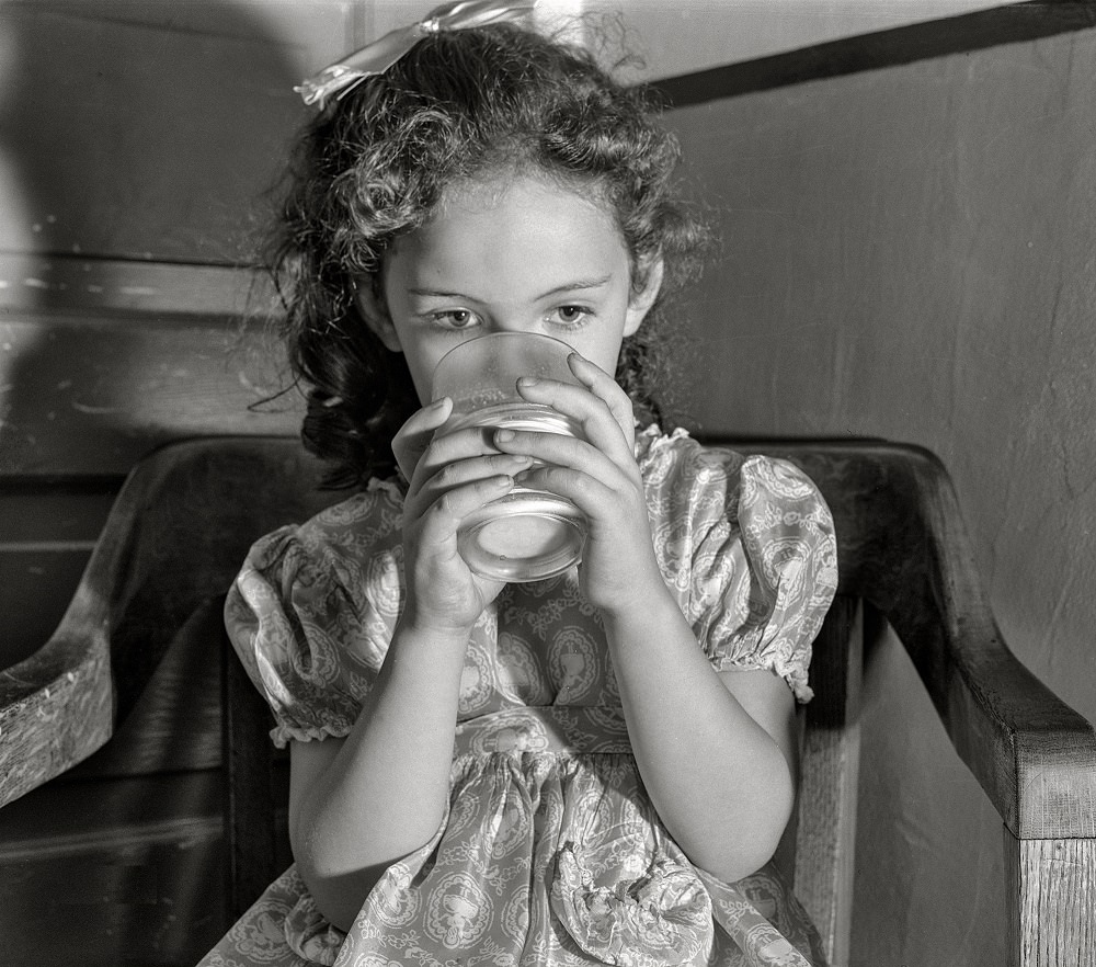 #12 Child drinking milk, Duluth, Minnesota, August 1941