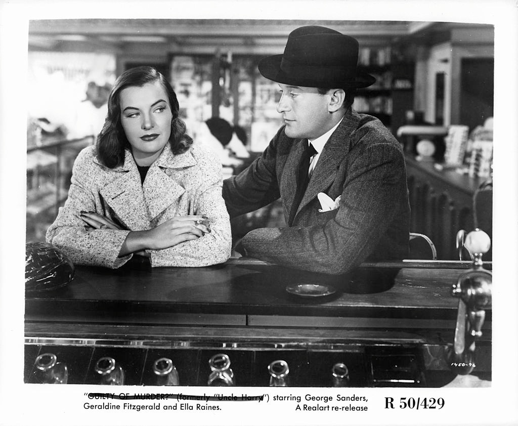 Ella Raines and George Sanders sitting at bar in a scene from the film ‘The Strange Affair Of Uncle Harry’, 1945.