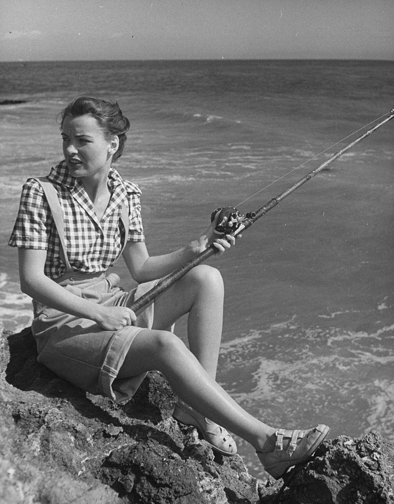 Ella Raines fishing in the ocean