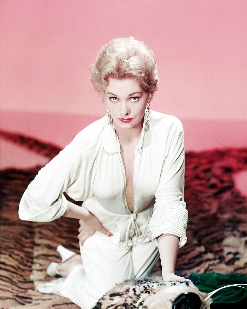 #15 Kim Novak kneeling on a tiger skin rug, circa 1955