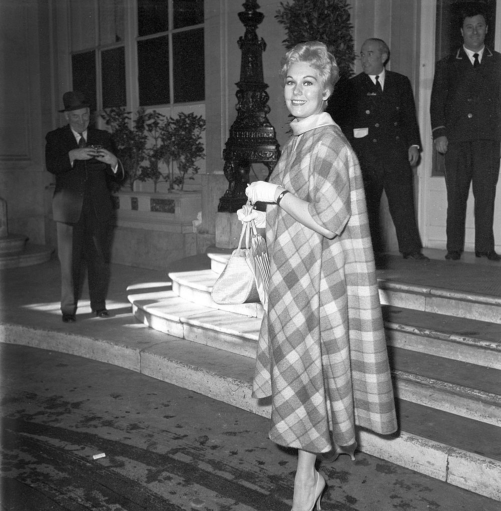 #30 Kim Novak leaving the Hotel Excelsior in Rome, 1957