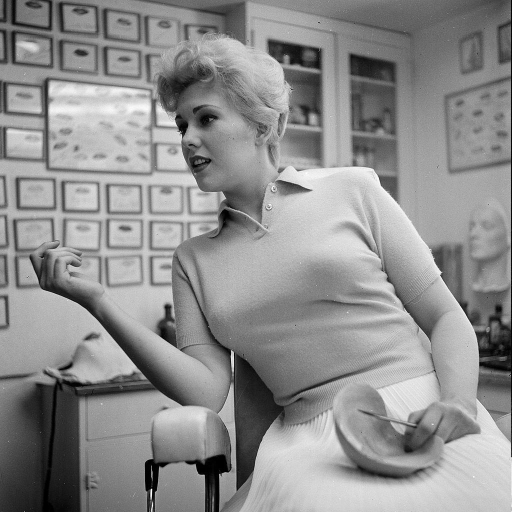 #44 Kim Novak discussing her mask in Los Angeles,CA, 1955