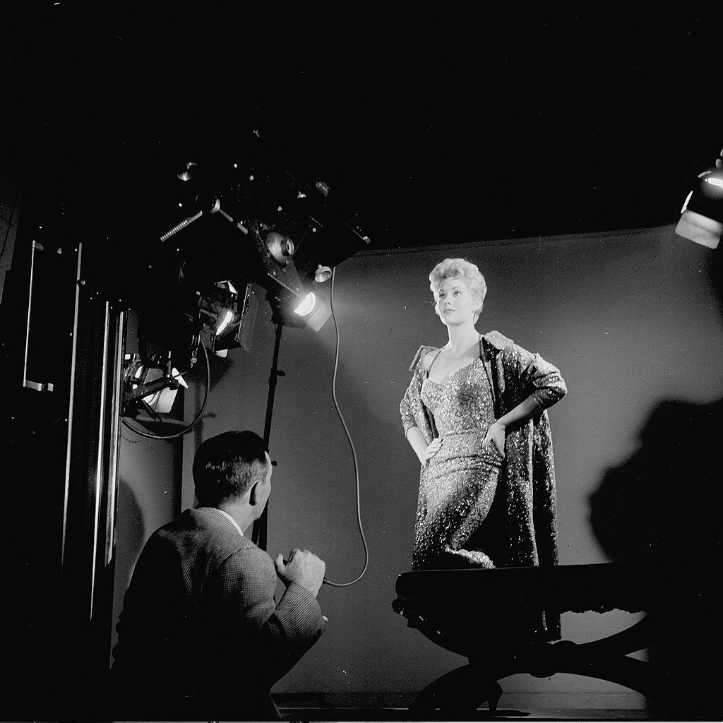 #34 Kim Novak poses for a portrait on stage in Los Angeles, 1955