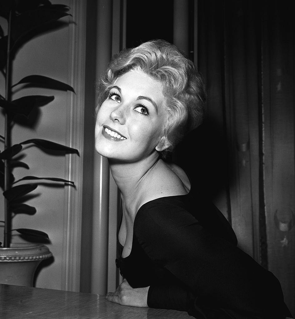 #35 Kim Novak at a press reception in London, 1956