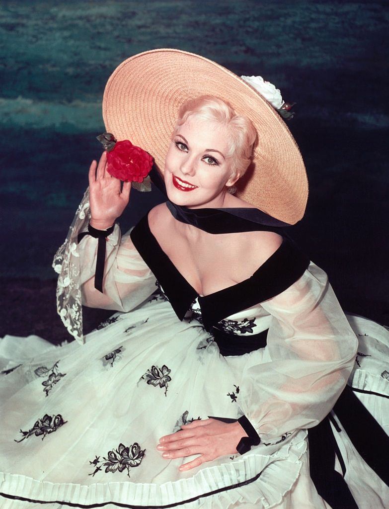 #11 Kim Novak Wearing a Straw Hat and Floral Dress