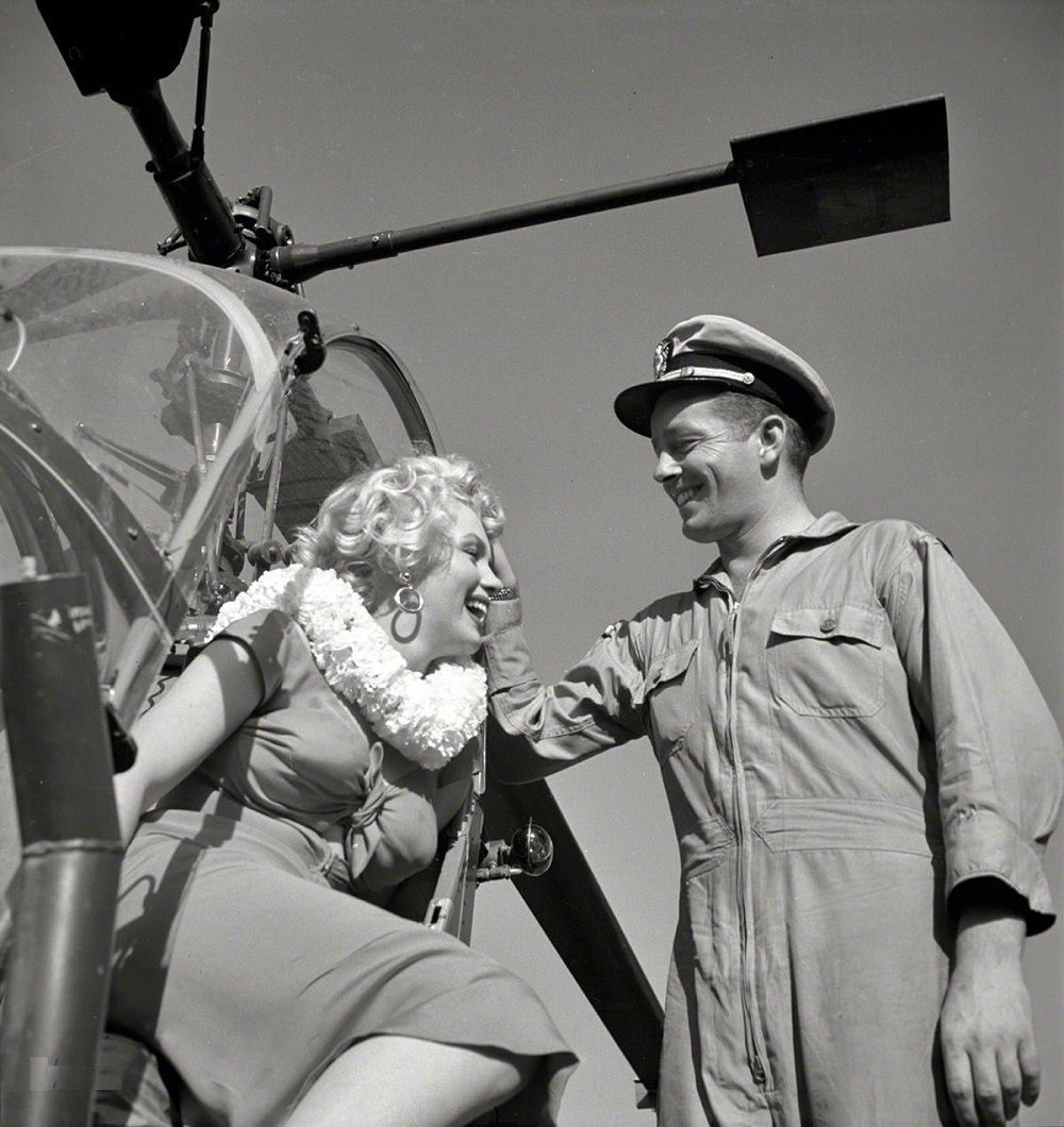 #29 Marilyn Monroe with a Navy pilot for the Look magazine assignment “Helicopter View of L.A, 1952