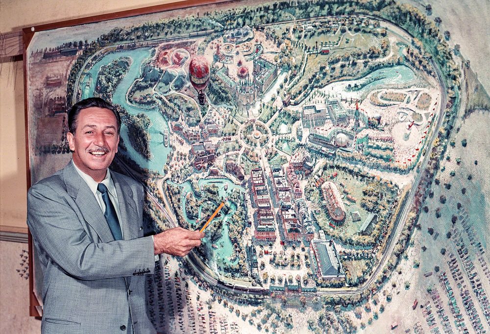 #4 Walt Disney pointing to a plan for Disneyland, under construction in Anaheim, Los Angeles, 1954