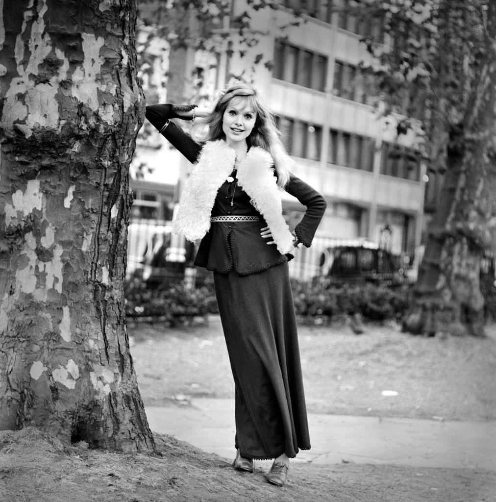 Madeline Smith wearing a black dress, London, 1969