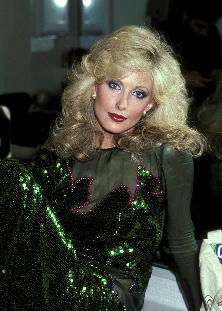 #33 Morgan Fairchild in shiny green dress, 1981